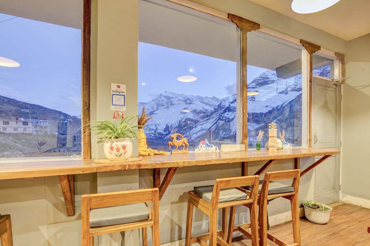 Oven Xpress restaurant mountain-view seating at Utpala House